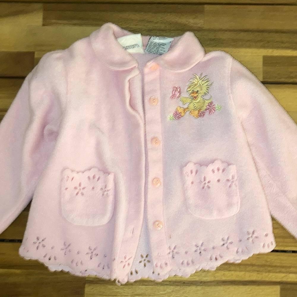 Pink sweater jacket with cutout detailing